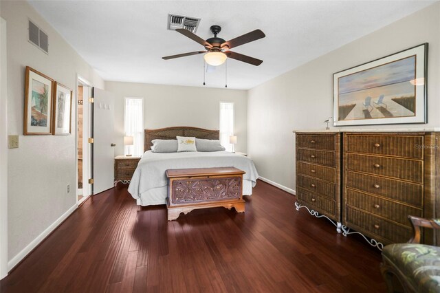 bedroom featuring wood finished floors, baseboards, and ceiling fan
