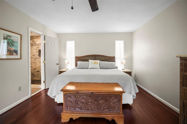 bedroom featuring baseboards, multiple windows, and wood finished floors
