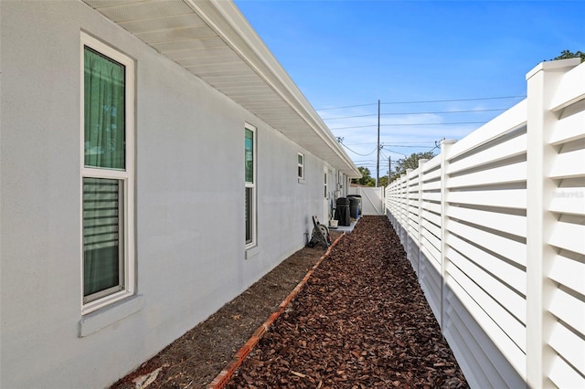 view of property exterior featuring fence