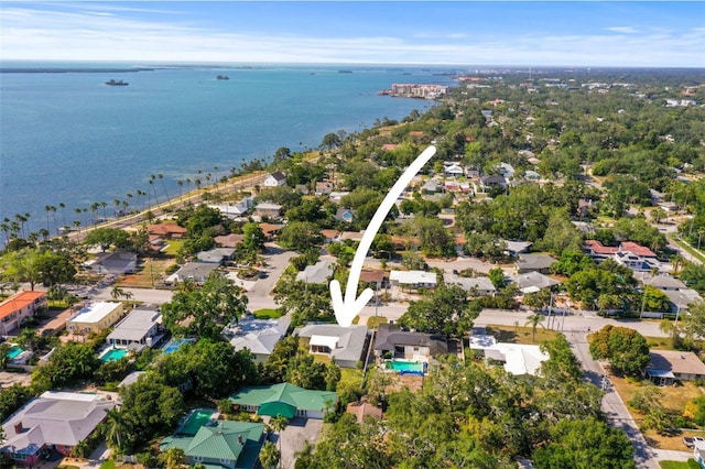 aerial view of residential area with a large body of water