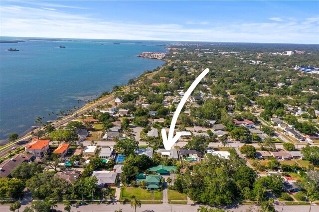 aerial perspective of suburban area featuring a nearby body of water