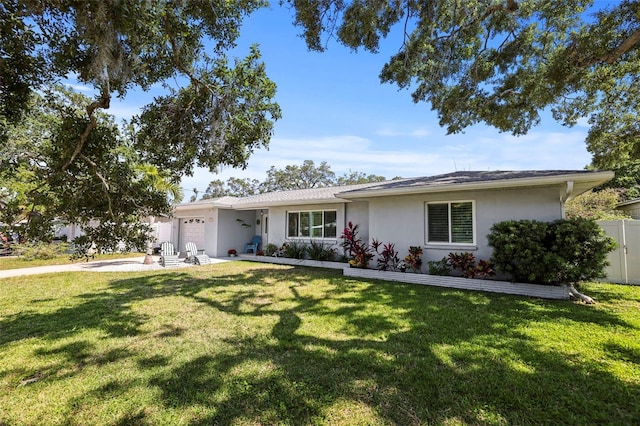 single story home featuring a garage, stucco siding, and driveway