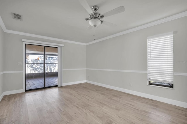 7360 Ulmerton Rd Unit 17D, Largo, FL 33771 - unfurnished room featuring wood finished floors, visible vents, crown molding, a ceiling fan, and baseboards