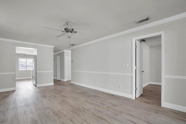 7360 Ulmerton Rd Unit 17D, Largo, FL 33771 - unfurnished room featuring wood finished floors, a ceiling fan, crown molding, visible vents, and baseboards