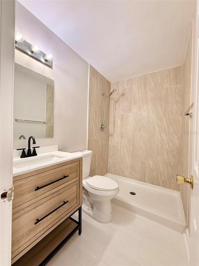 2201 Flamingo Ave, Deltona, FL 32738 - bathroom with a tile shower, toilet, and vanity