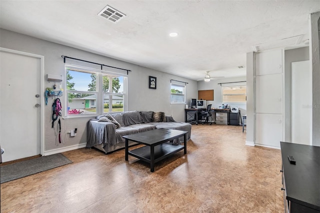 6816 13th St N, Saint Petersburg, FL 33702 - living room featuring a desk, baseboards, ceiling fan, and light flooring