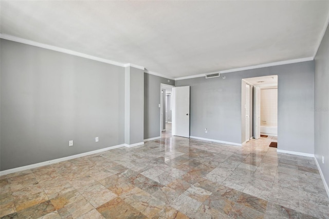 empty room featuring visible vents, baseboards, and ornamental molding