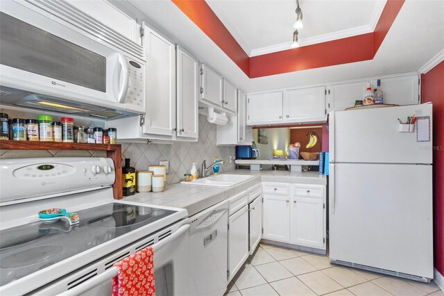 3823 N Oak Dr Unit K22, Tampa, FL 33611 - kitchen with a sink, white cabinetry, white appliances, and tile countertops