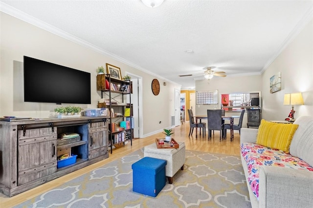 3823 N Oak Dr Unit K22, Tampa, FL 33611 - living room with baseboards, ornamental molding, ceiling fan, and wood finished floors