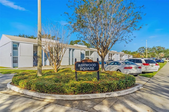 3823 N Oak Dr Unit K22, Tampa, FL 33611 - view of building exterior with uncovered parking and a residential view