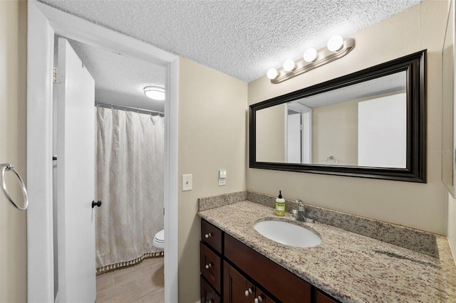 2207 S Carolina Ave Unit 7, Tampa, FL 33629 - bathroom with toilet, vanity, a textured ceiling, and a shower with shower curtain