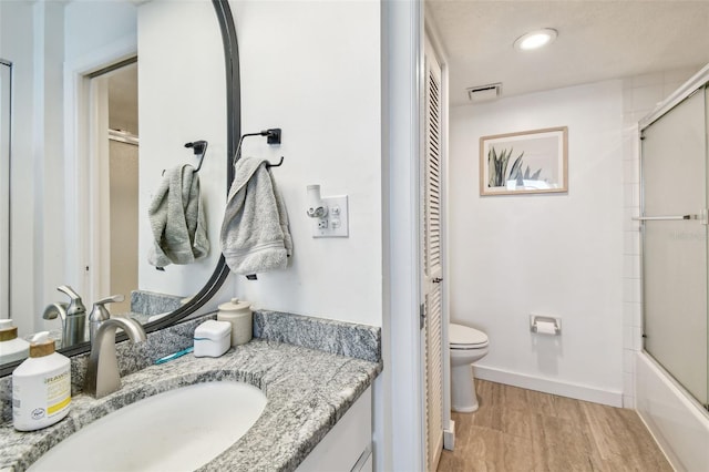 500 Treasure Island Cswy Unit 607, Treasure Island, FL 33706 - full bath featuring toilet, vanity, recessed lighting, and baseboards