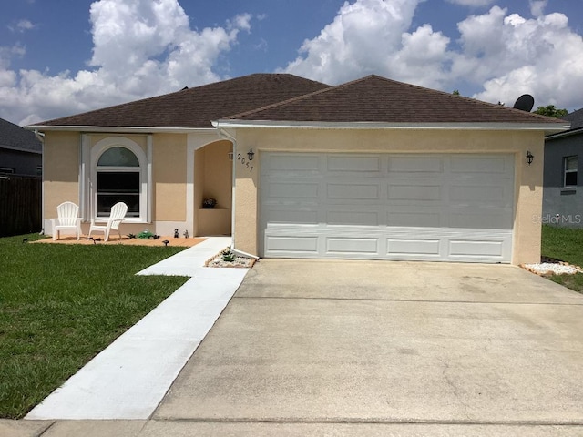 2057 Swift Rd, Oviedo, FL 32766 - ranch-style home with stucco siding, driveway, a front yard, and a garage