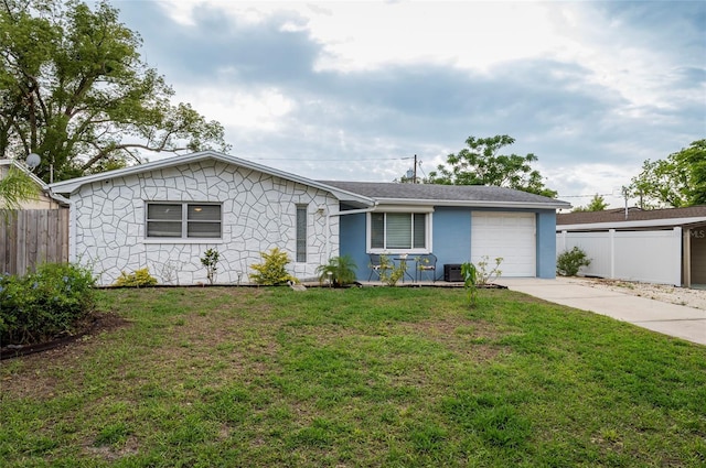 single story home with an attached garage and driveway