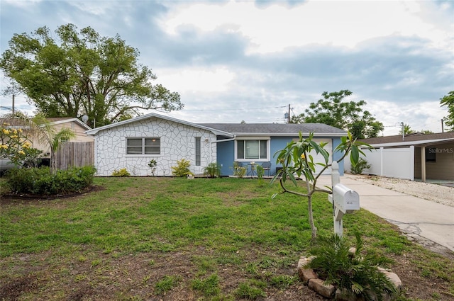 ranch-style house featuring stucco siding