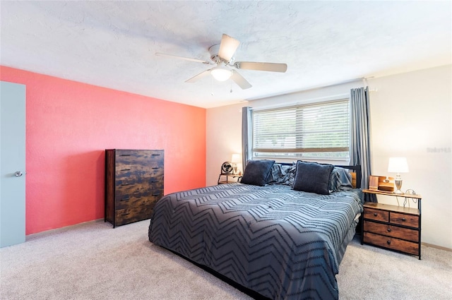 carpeted bedroom featuring a ceiling fan