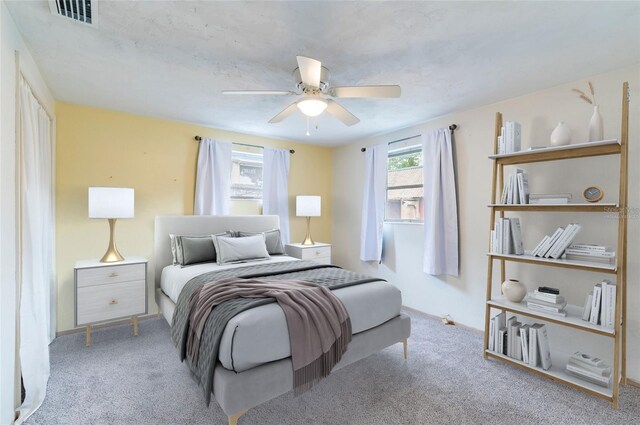 carpeted bedroom featuring a ceiling fan