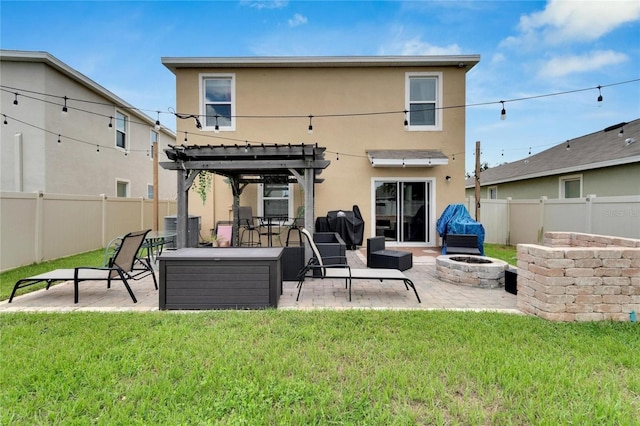 back of property with a pergola, stucco siding, central AC unit, and a patio