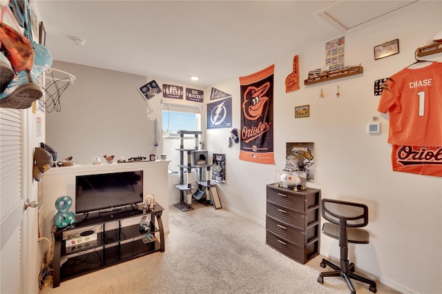 sitting room featuring carpet floors and baseboards