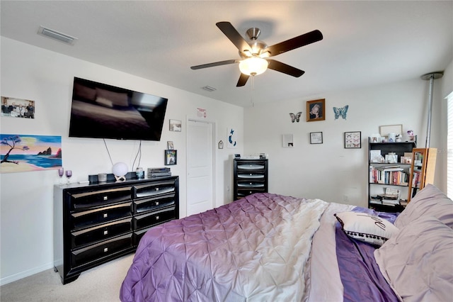 bedroom with light carpet and ceiling fan