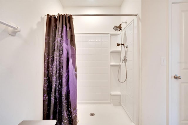 bathroom with a shower stall