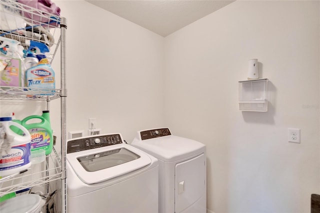 laundry area with washing machine and dryer