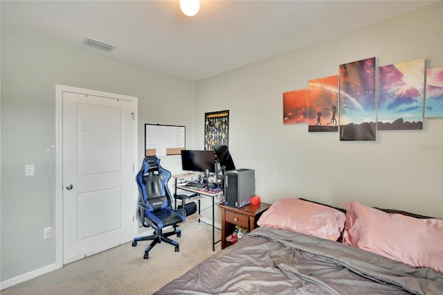 bedroom featuring carpet, a desk, and baseboards