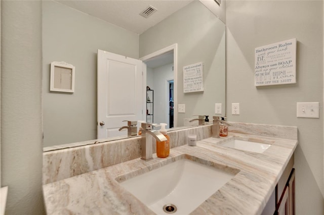 bathroom featuring double vanity
