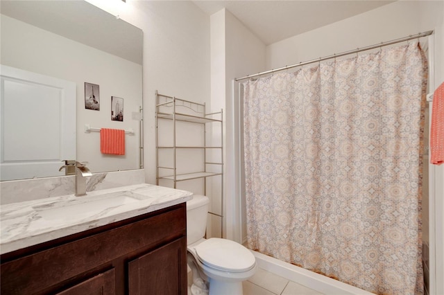 bathroom featuring toilet, a shower with shower curtain, vanity, and tile patterned floors