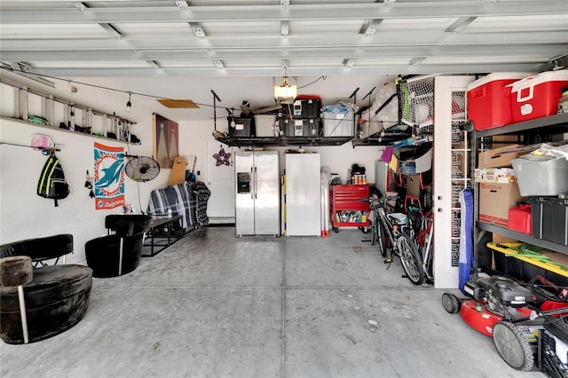 garage with stainless steel fridge and refrigerator