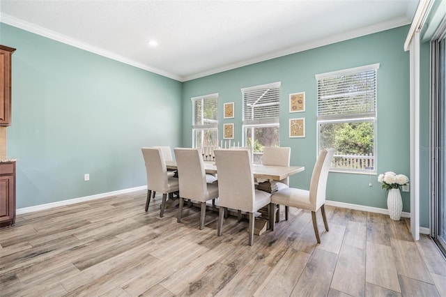 4094 Windcrest Dr, Wesley Chapel, FL 33544 - dining space with a wealth of natural light, light wood-style floors, and ornamental molding