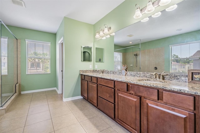 4094 Windcrest Dr, Wesley Chapel, FL 33544 - full bath with a sink, tile patterned flooring, tiled shower, and visible vents