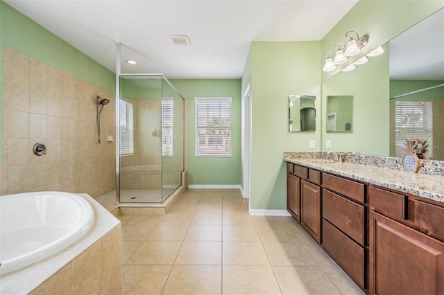 4094 Windcrest Dr, Wesley Chapel, FL 33544 - bathroom featuring a garden tub, tile patterned floors, visible vents, a shower stall, and vanity