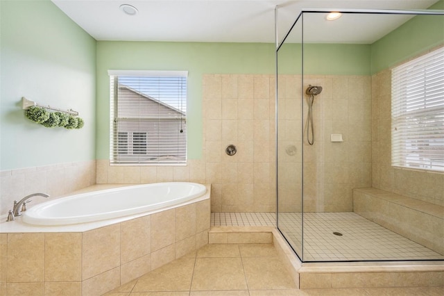 4094 Windcrest Dr, Wesley Chapel, FL 33544 - full bathroom with tile patterned floors, a tile shower, and a garden tub