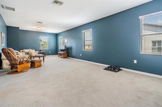 4094 Windcrest Dr, Wesley Chapel, FL 33544 - living area with baseboards, visible vents, and carpet