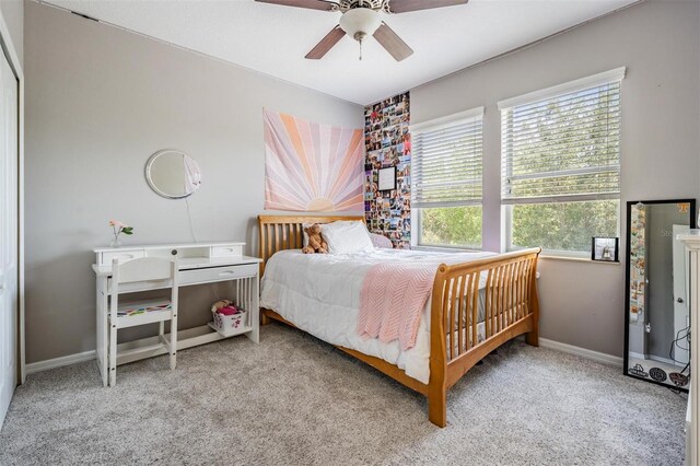 4094 Windcrest Dr, Wesley Chapel, FL 33544 - carpeted bedroom with baseboards and ceiling fan