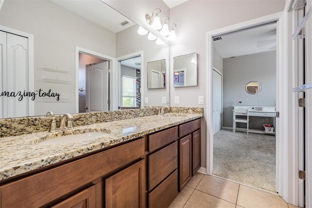 4094 Windcrest Dr, Wesley Chapel, FL 33544 - bathroom with double vanity, visible vents, tile patterned flooring, and a sink
