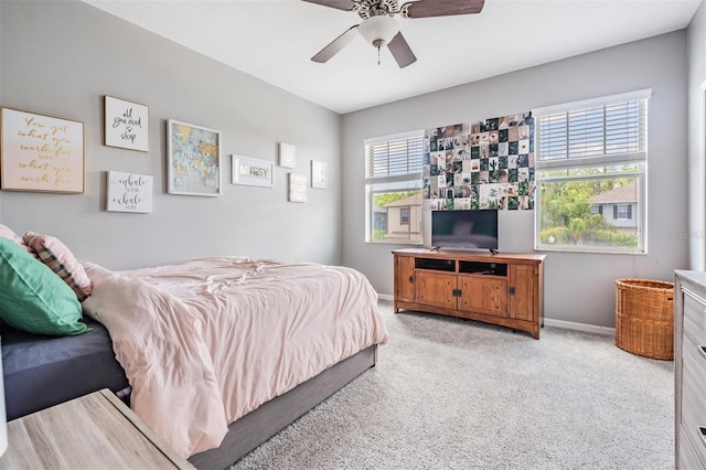 4094 Windcrest Dr, Wesley Chapel, FL 33544 - bedroom with baseboards, ceiling fan, and light colored carpet