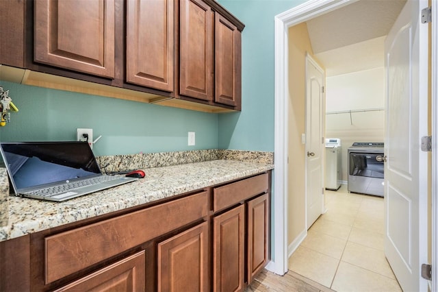 4094 Windcrest Dr, Wesley Chapel, FL 33544 - clothes washing area with separate washer and dryer, laundry area, baseboards, and light tile patterned flooring