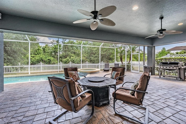 4094 Windcrest Dr, Wesley Chapel, FL 33544 - view of patio featuring a fenced backyard, an in ground hot tub, a ceiling fan, and a grill