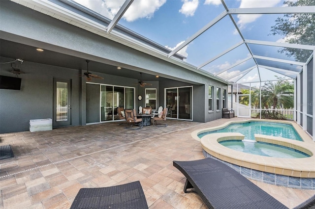 4094 Windcrest Dr, Wesley Chapel, FL 33544 - view of swimming pool with a pool with connected hot tub, a patio, a lanai, and a ceiling fan