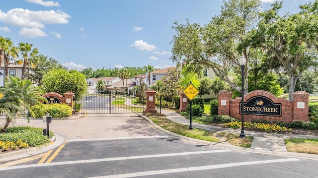 4094 Windcrest Dr, Wesley Chapel, FL 33544 - view of road with traffic signs, curbs, sidewalks, and a residential view