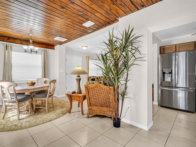 dining area with an inviting chandelier, wood ceiling, visible vents, baseboards, and light tile patterned flooring