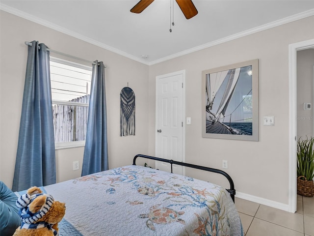 bedroom featuring light tile patterned floors, ceiling fan, baseboards, and crown molding