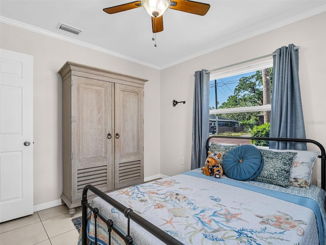 bedroom with light tile patterned floors, a ceiling fan, visible vents, baseboards, and ornamental molding