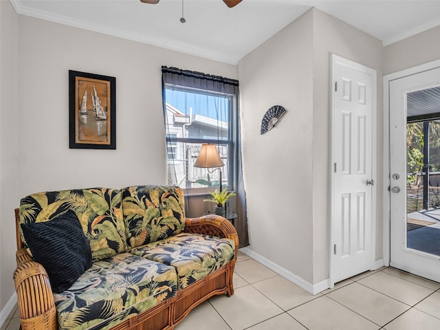 sitting room featuring light tile patterned floors, baseboards, and ceiling fan