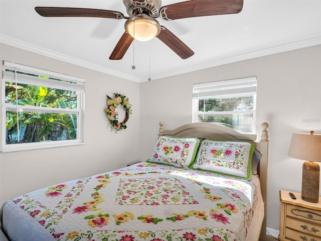 bedroom featuring ceiling fan and crown molding