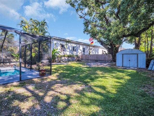 view of yard with a storage shed, an outdoor structure, a fenced in pool, and a fenced backyard