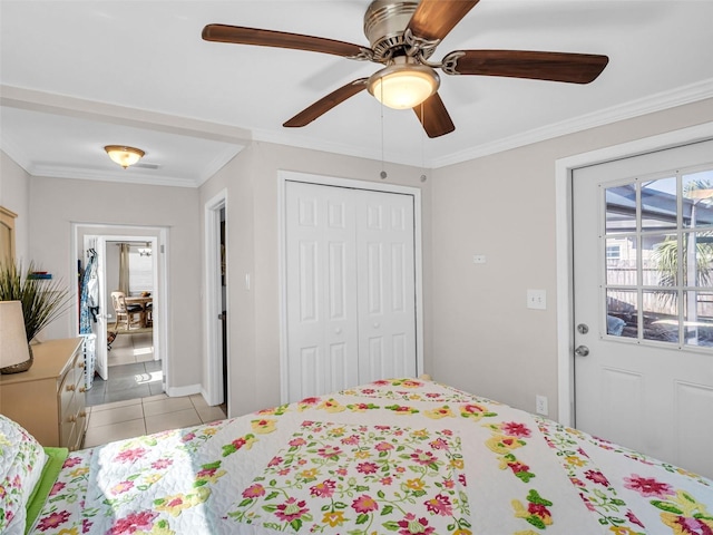 bedroom featuring ceiling fan, ornamental molding, a closet, and tile patterned floors