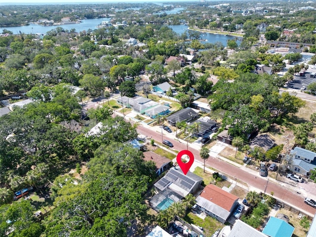 drone / aerial view with a water view and a residential view